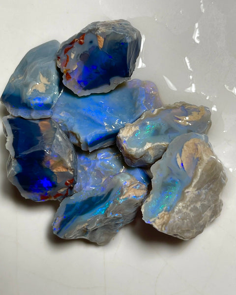 Lightning Ridge Black & Dark Knobby opal splits 135.00cts Mostly blues with some Greens bars sowing potential to cut 23x20x8mm to 17x15x12mm NSW185