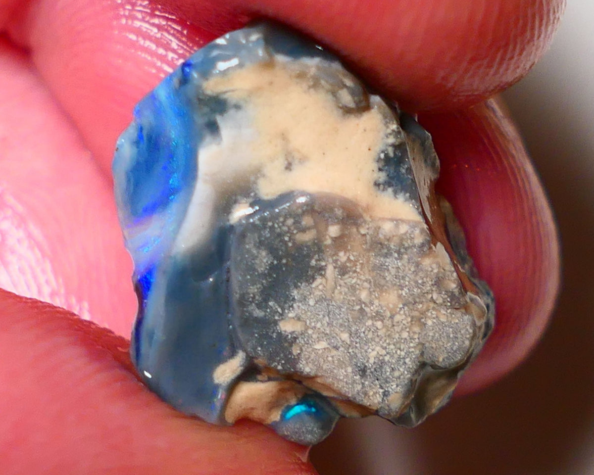 Lightning Ridge Rough Opal 6.75cts Dark Base Gamble Seam some Blues in the bar 20x15x5mm 0642