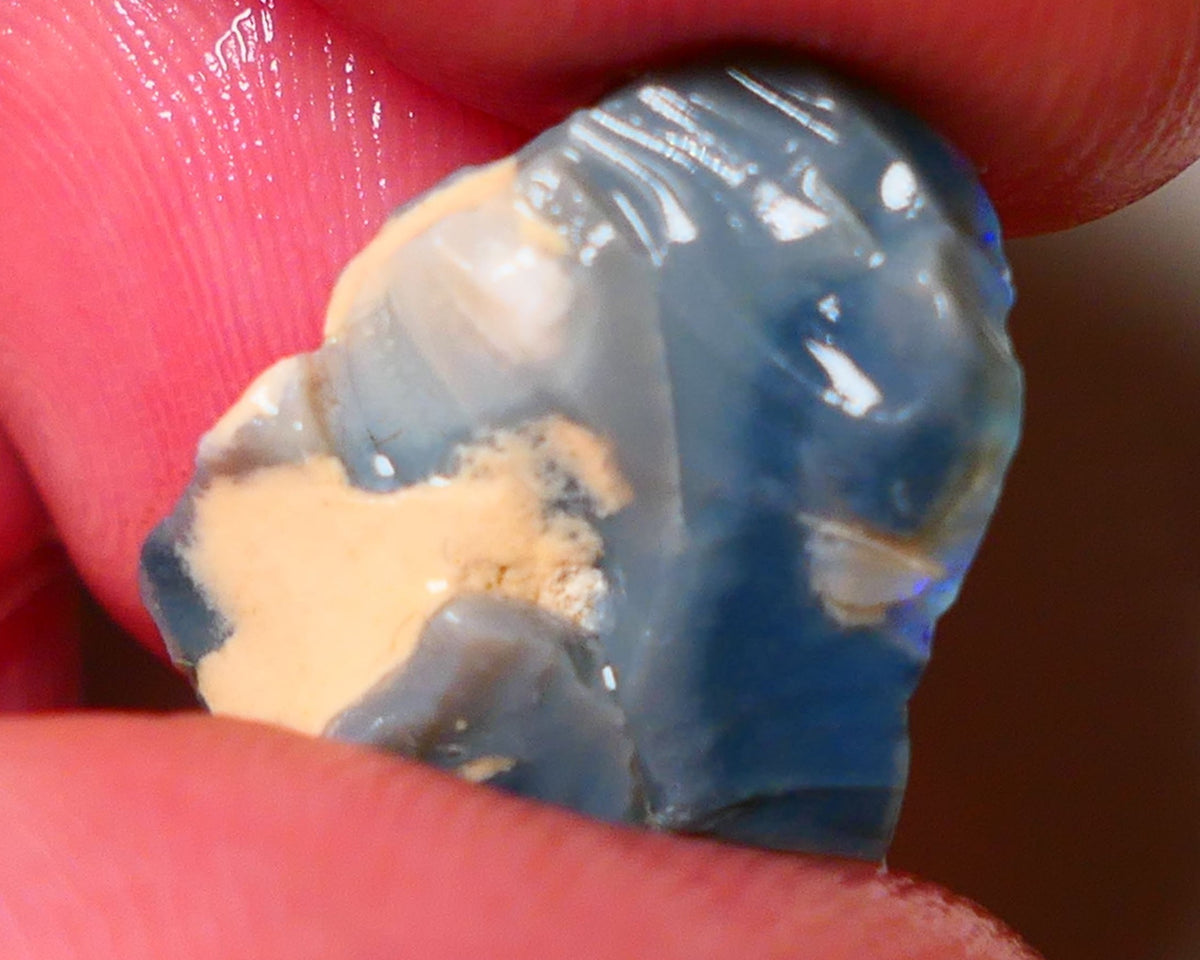 Lightning Ridge Rough Opal 6.75cts Dark Base Gamble Seam some Blues in the bar 20x15x5mm 0642