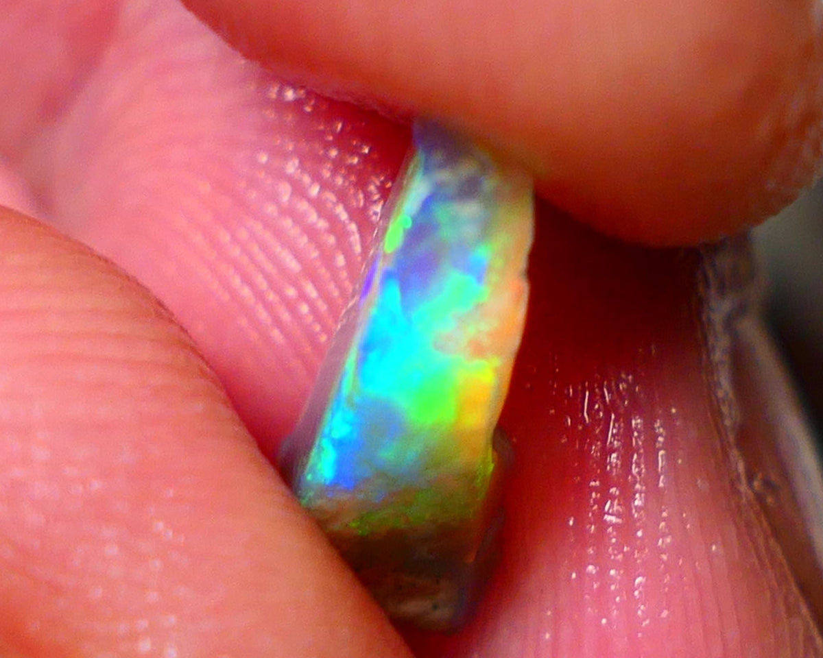 Small Candy to Cut Crystal on dark base 1.80cts Exotic bar with Vivid & Bright fires 14x5x4mm NS144