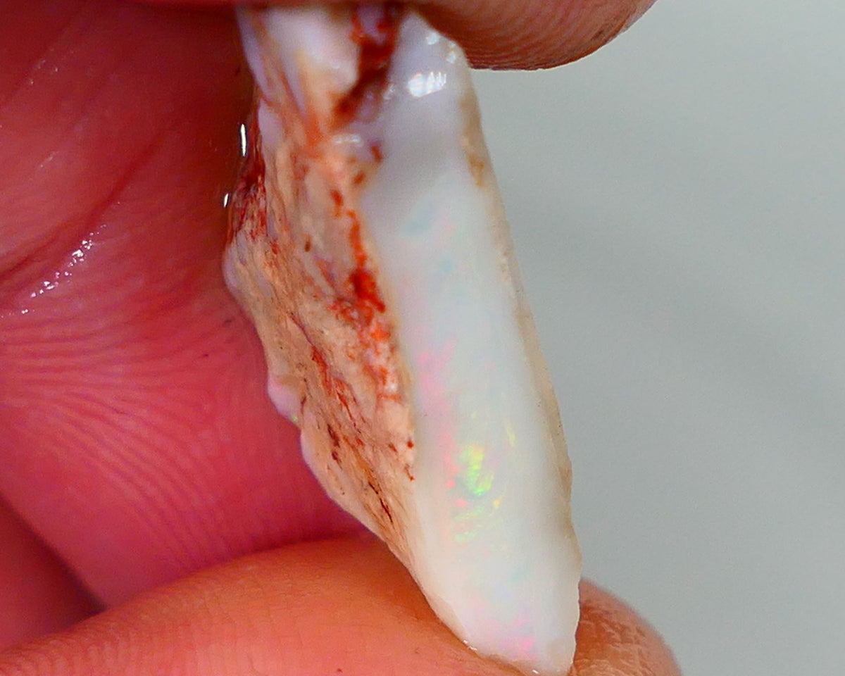 Lightning Ridge Rough Opal 7.25cts Light base Seam showing Bit of Yellow Dominant M.colours 22x10x4mm NS330