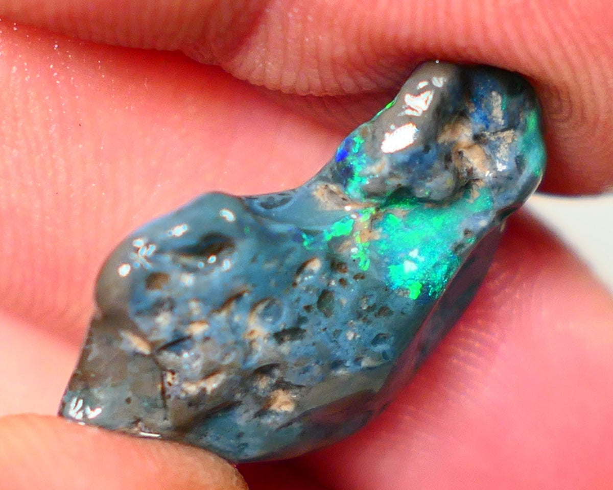 Lightning Ridge Rough Opal 14.00cts Dark Base rough with some pinfire flashes of bright Green/Blue Bar 24x17x7mm NS348