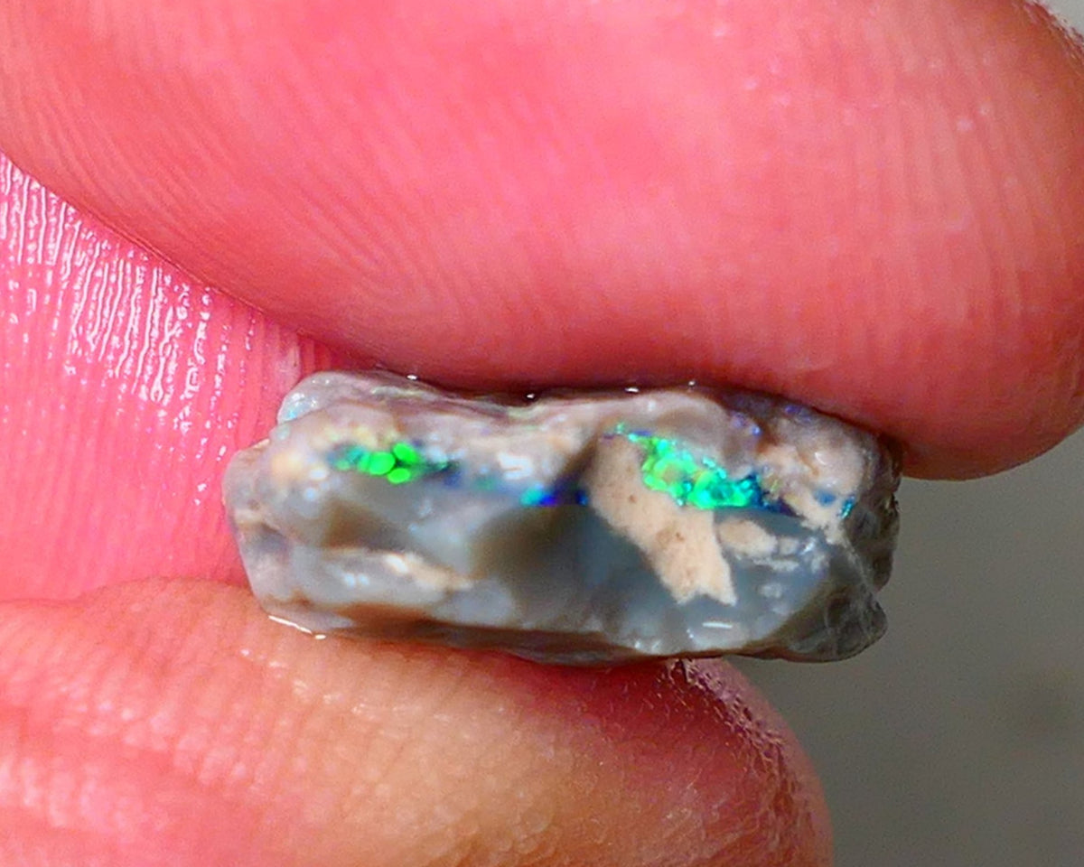 Lightning Ridge Seam opal rough 6.05cts showing Gemmy Very bright consistent flt bar with multi colours to cut worth a gamble on this one cut a gem 16x12x6mm ALP117