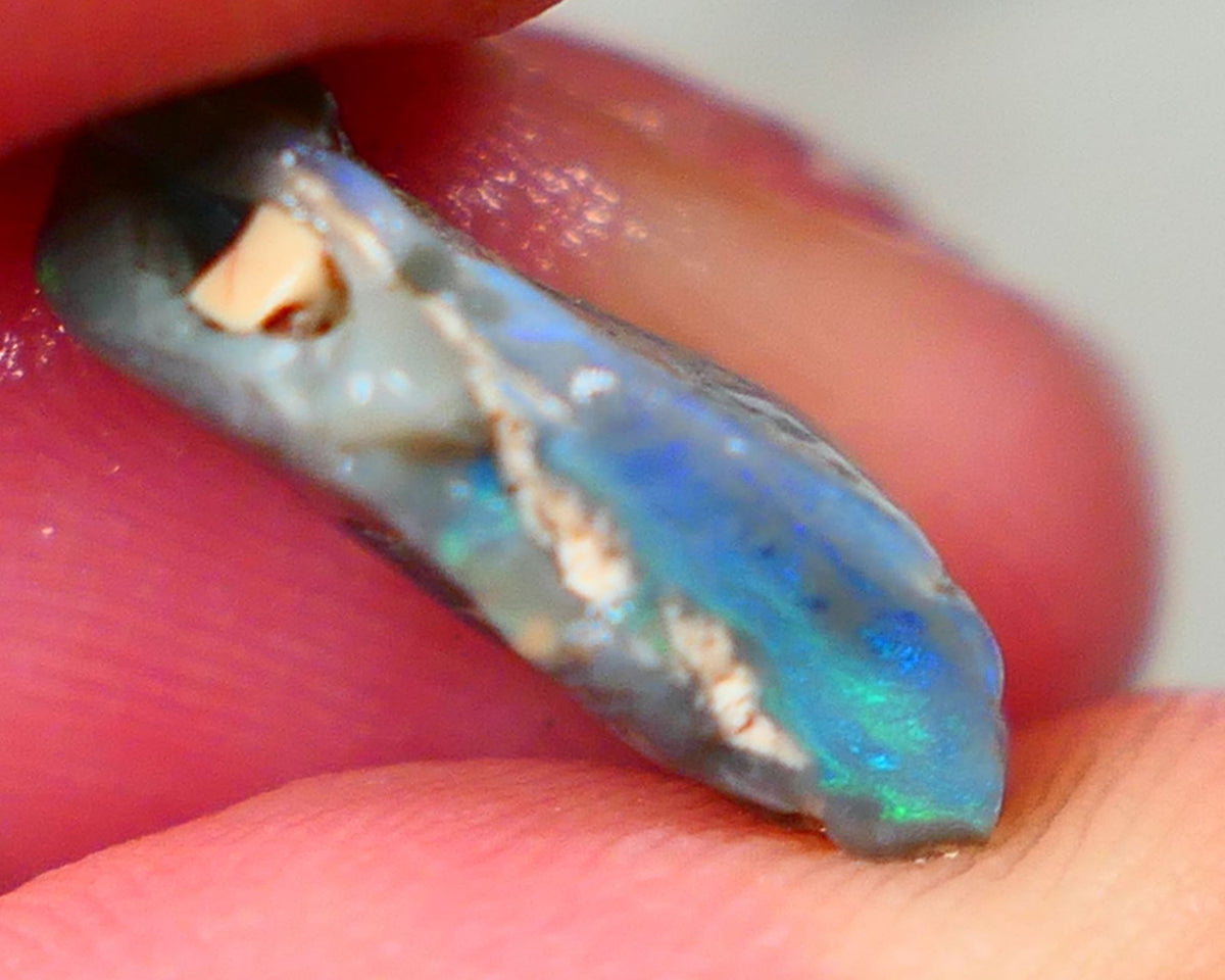 Lightning Ridge Rough Dark base knobby opal 4.50cts showing Greens & Blues in exposed side of bar with blue showing through the skin gamble to cut 16x10x5mm Auction90