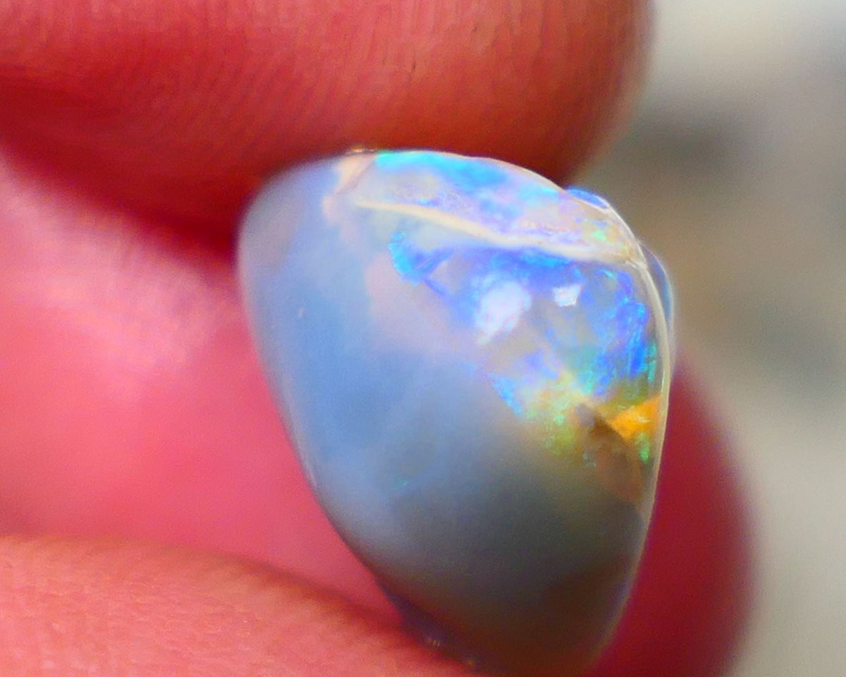 Lightning Ridge Rough knobby opal 7.80cts Dark base fresh from wash showing blue fires in scattered a scattered 15x10x9mm Auction131