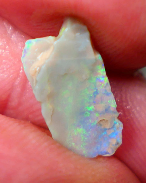 Lightning Ridge Dark base Seam opal 1.95cts Note this is thin So suit inlay/doublet etc Nice Yellow/Blue/Green fires to work with 15x7x3mm GMB-021