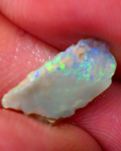 Lightning Ridge Dark base Seam opal 1.95cts Note this is thin So suit inlay/doublet etc Nice Yellow/Blue/Green fires to work with 15x7x3mm GMB-021