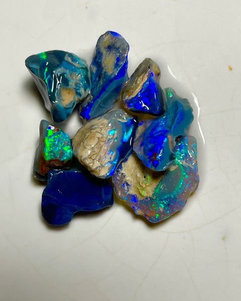 Very Bright Blue /Green dominant fires in this parcel of Black & Dark opal rough 35.75cts Lightning Ridge Material to cut 18x14x3mm to 10x8x7mm NSW184