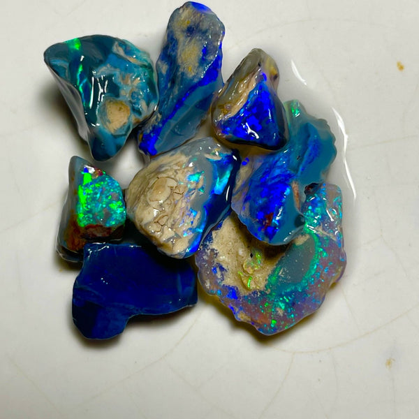 Very Bright Blue /Green dominant fires in this parcel of Black & Dark opal rough 35.75cts Lightning Ridge Material to cut 18x14x3mm to 10x8x7mm NSW184
