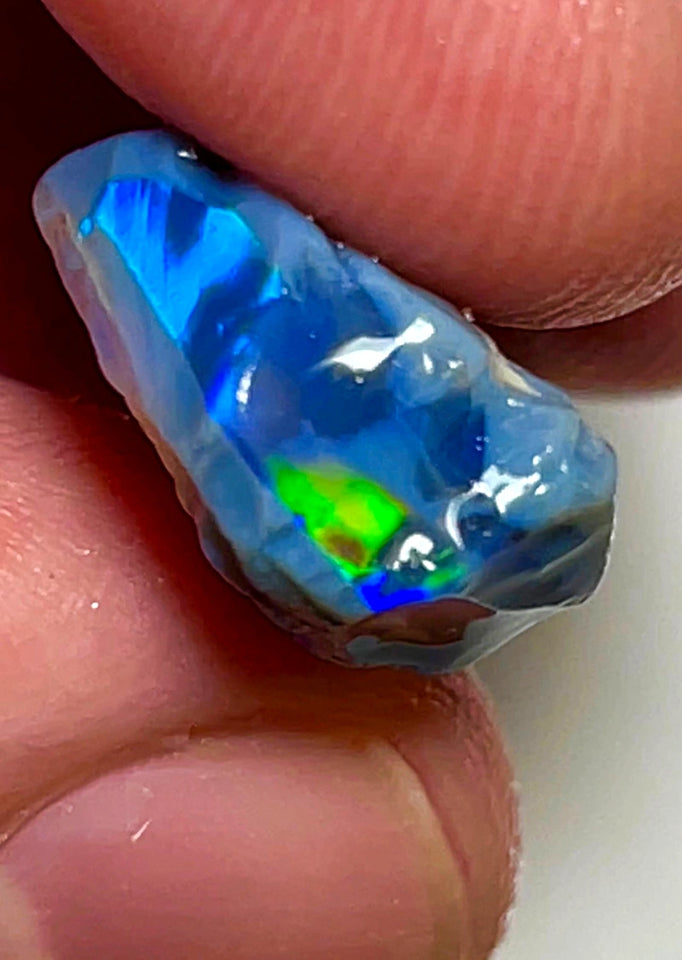 Lightning Ridge Rough Opal 12.4cts Stunning Black base Seams to cut Gorgeous Bright Multi fires in bar to cut 26x12x8mm WAD43